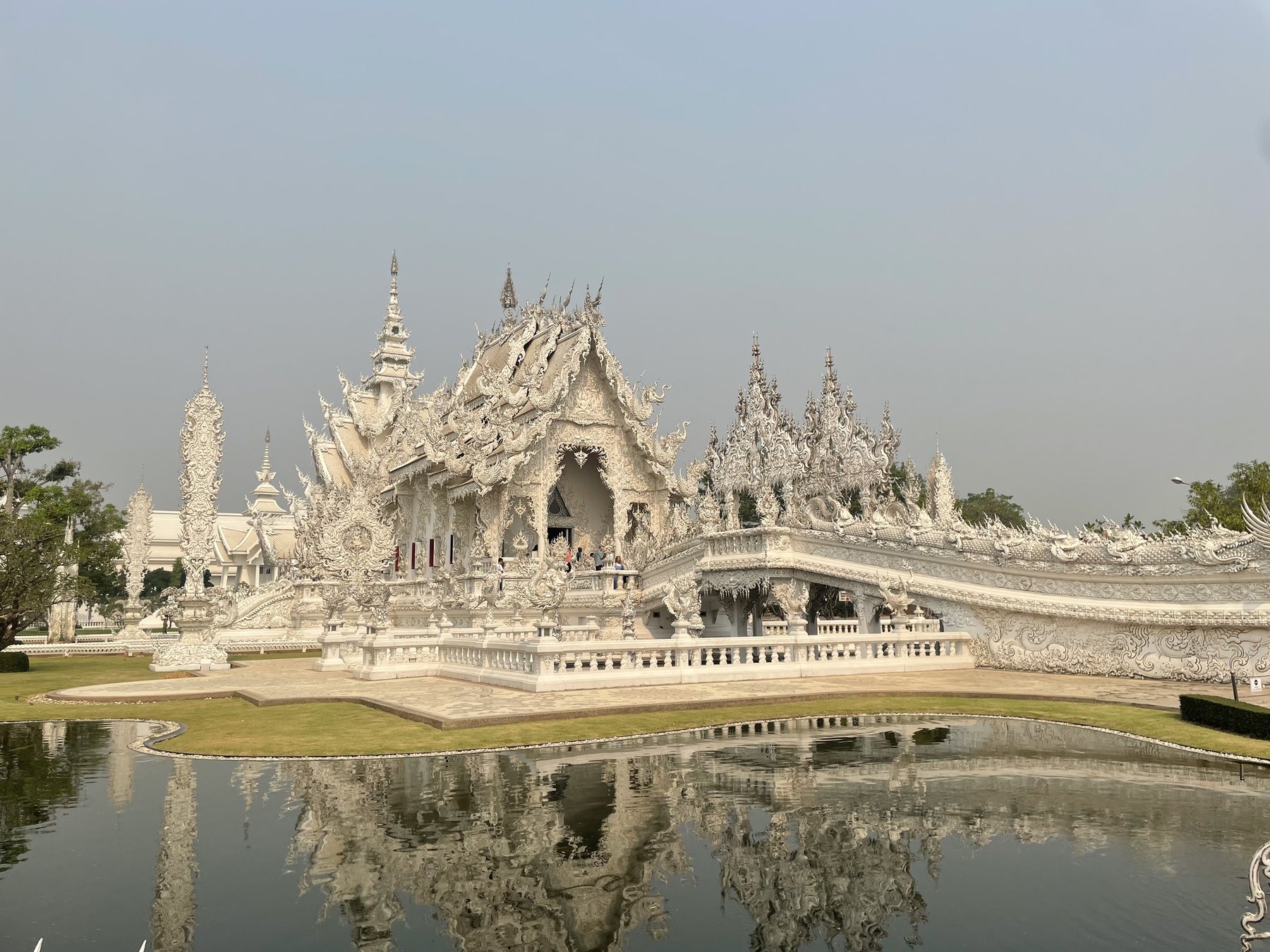 White Temple and its reflection in Chiang Rai