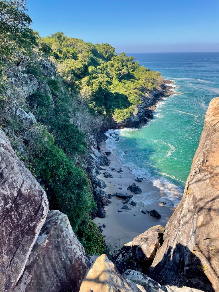 Turquoise cove seen from a rocky cliff